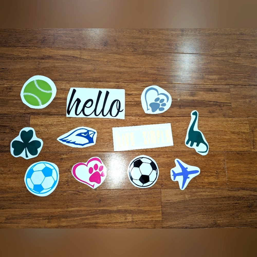 11 Assorted vinyl decals. Sports. Pets. Hello. Dinosaurs. #1.